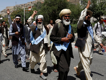 Dozens of men march for peace near Ghazni, on June 2018