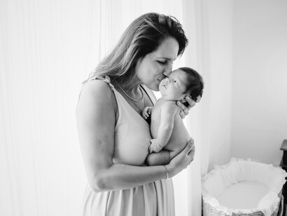 A serene portrait of motherhood—this loving moment mirrors the call for a world led by empathy, care, and balance
