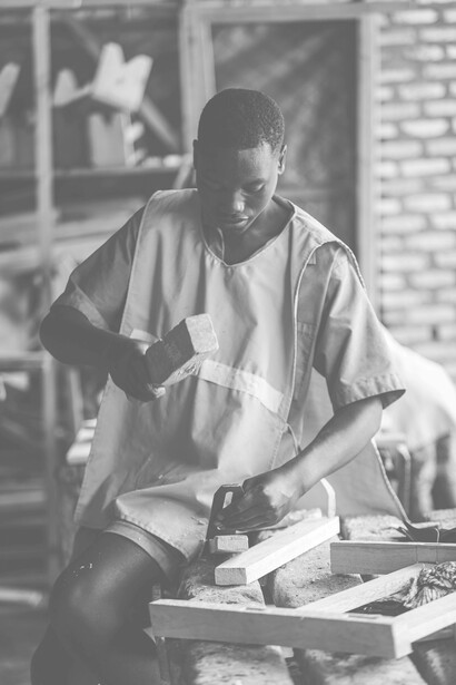 Young man working in a wood workshop