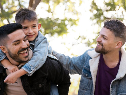 A joyful LGBTQ+ family, with same-sex parents nurturing their children in a supportive environment