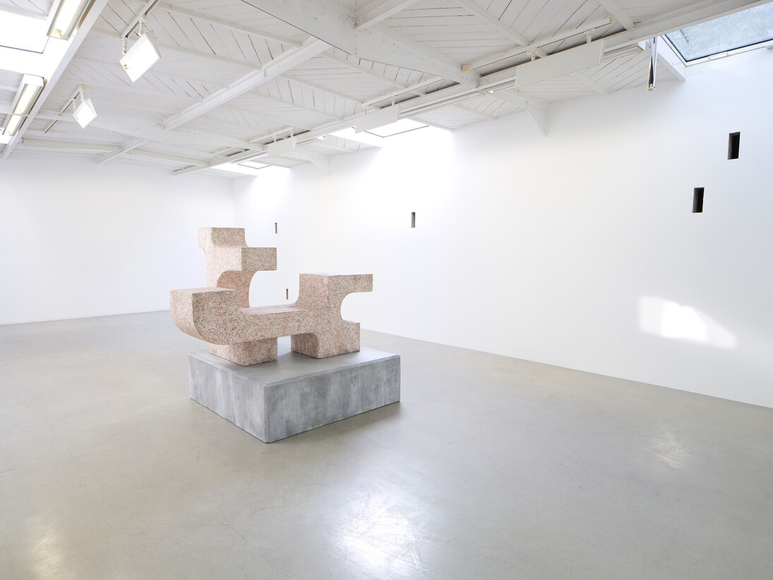 Valentin Carron - Un mur cinq trous, 2014, 5 arrow loopholes, concrete, painting, wood, Variable dimensions - Ravage with granite (after André Tommasini), 2014, Polystyrene and resin, 147 x 162 x 130 cm, View of the exhibition « L’autoroute du soleil à minuit », kamel mennour (47, rue Saint-André des Arts), Paris, 2015 © Valentin Carron, Photo: Fabrice Seixas, Courtesy the artist and kamel mennour, Paris