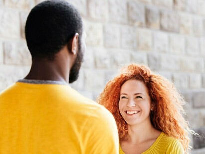 A joyful interracial couple with an African American man and a white woman sharing a happy moment together