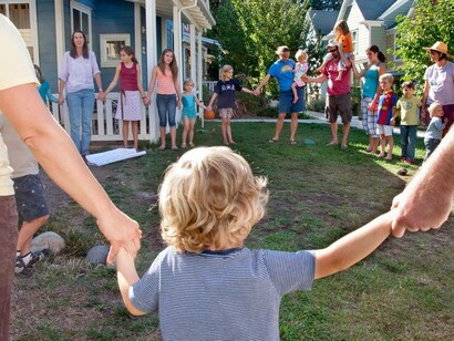 Parents and their young children participating in cohousing events