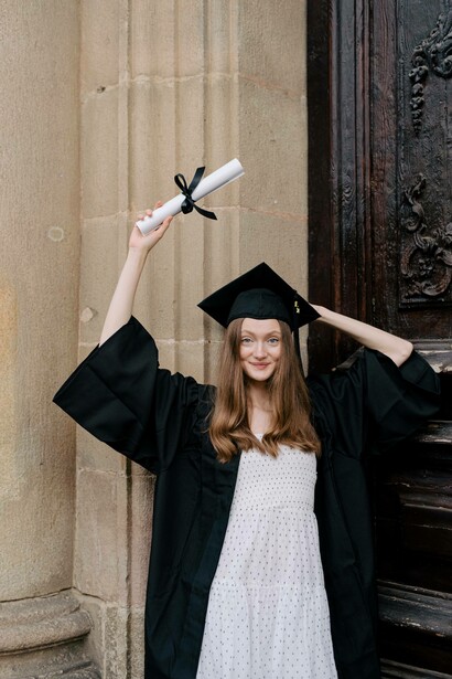 Woman holding graduation scroll