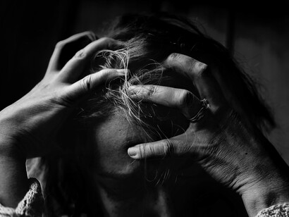 Woman holding her head
