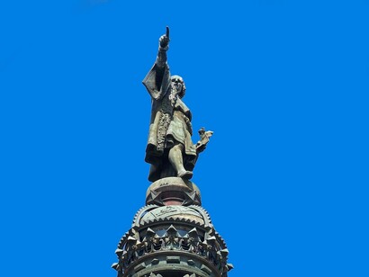 A statue of Christopher Columbus pointing in the distance Barcelona, Spain