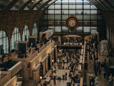 The iconic clock inside Musée d'Orsay in Paris, France, representing how institutions quietly govern people's relationship with time