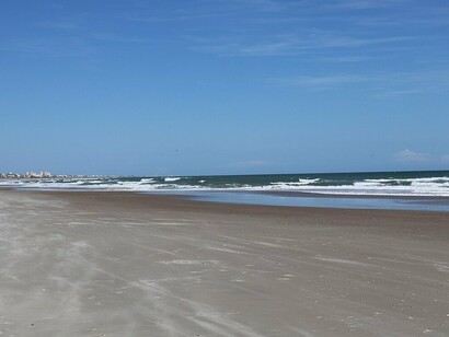 Bright skies and calm waves welcome visitors to Emerald Isle’s pristine shoreline