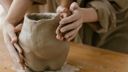 Sculpting clay could be used as a metaphor for molding one's personality through experiences