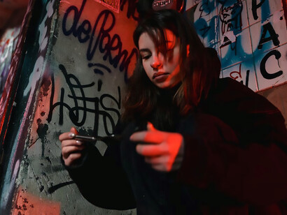 A young woman on the verge of drug use, contemplating a pivotal moment