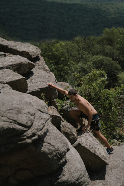 A man rock climbing in nature because he has the confidence to do so