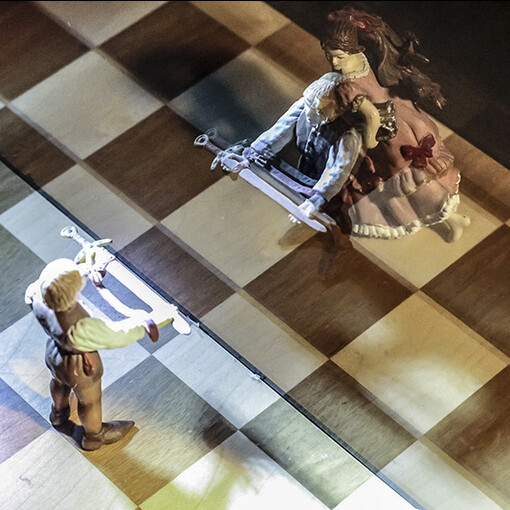 The patient places a certain number of action figures and characters from our collective unconscious on a chessboard